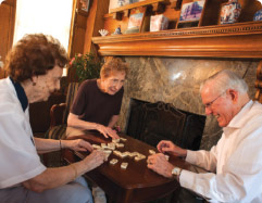 Elderly people playing dominos