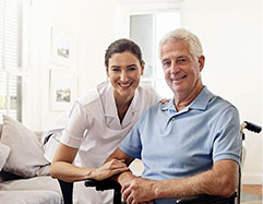 Elderly man at home with caregiver